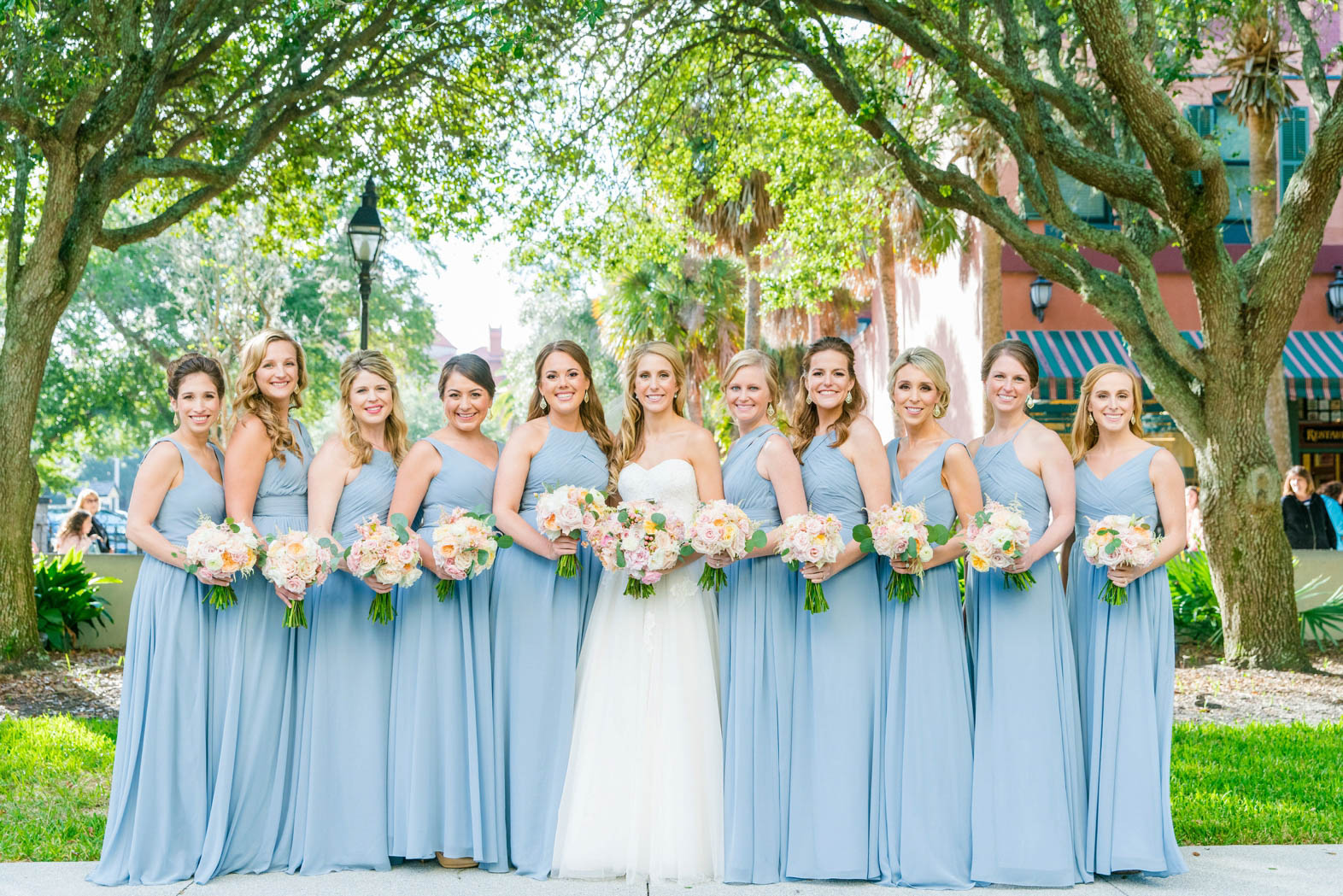bride with bridesmaids in light blue dresses in st augustine, florida