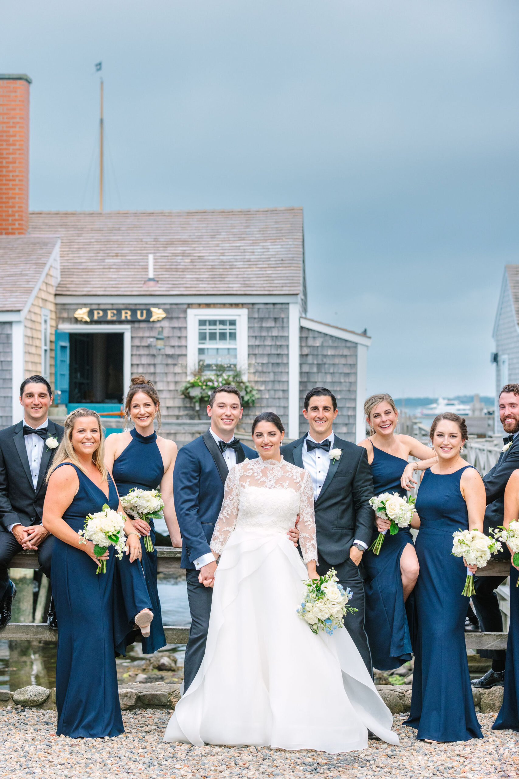 vogue inspired wedding party group photo at the wharf on nantucket island